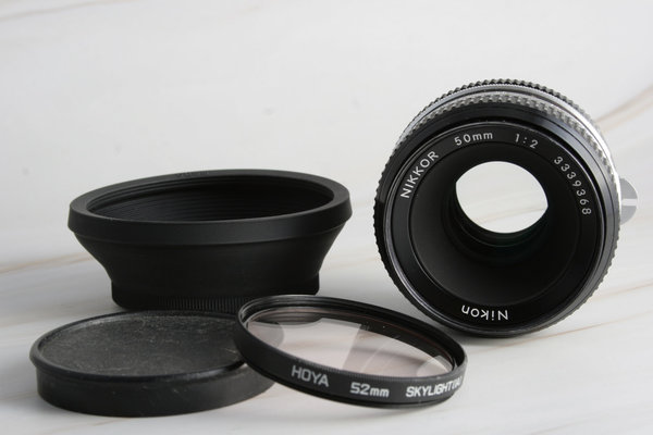 webersfotoshop Nikon Nikkor 50mm 1:2 Standardobjektiv NAI inkl. Equipment; gebraucht